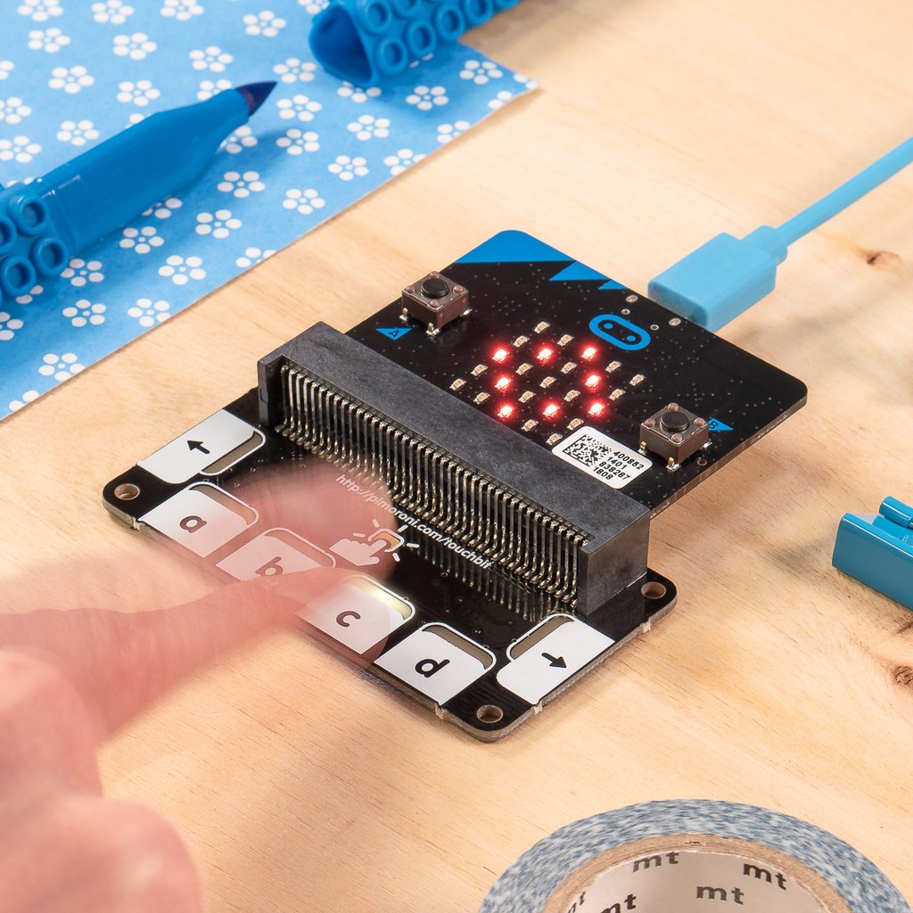 The Pimoroni touch:bit adds glowing capacitance touch to your micro:bit
