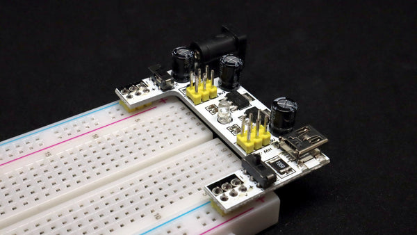diagonal view of breadboard and power board controls